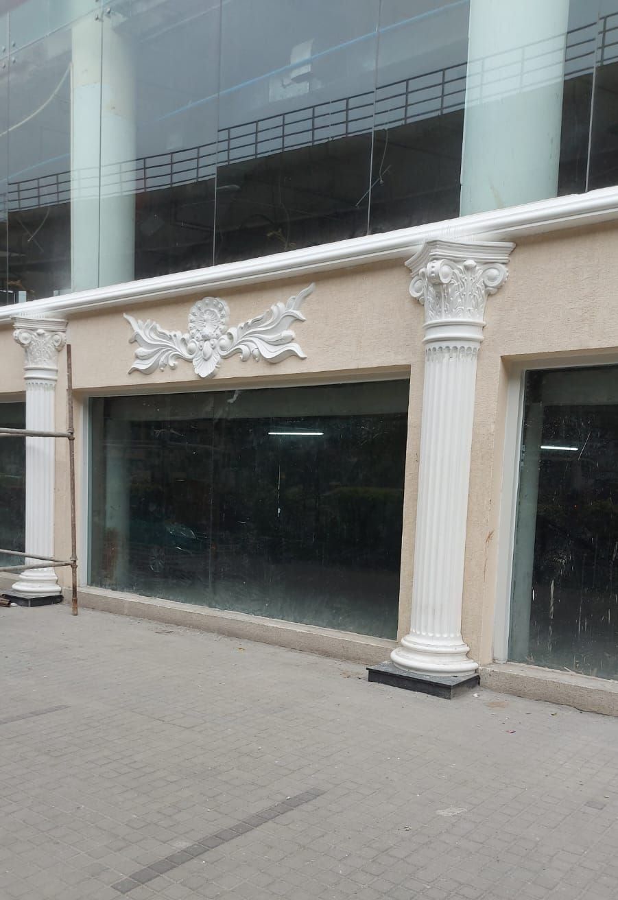 A ground-floor bay, with the cornice band above the column — 1 MG Lido Mall, Bangalore, Karnataka