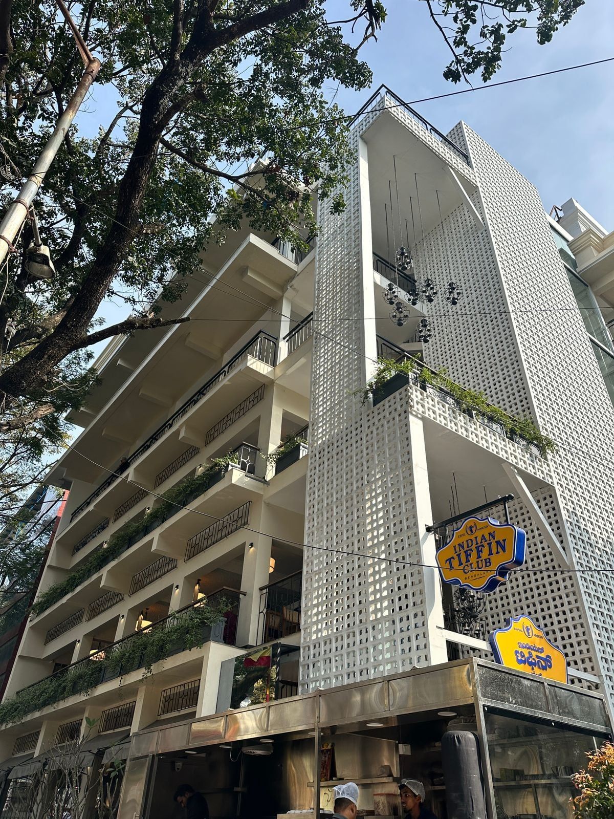 The building from below, with the screen folding round the corner — Indian Tiffin Club, Bangalore, Karnataka