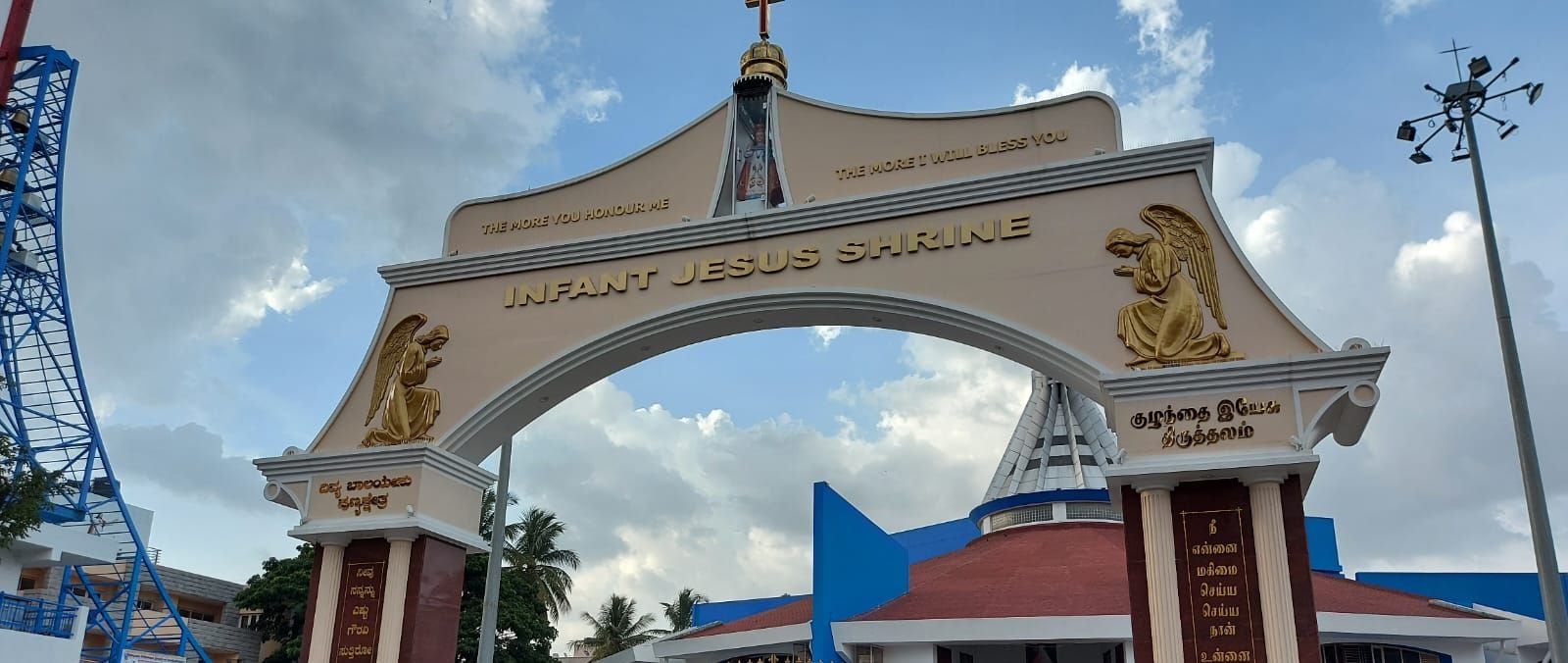 The gateway from the road, with the church behind — Infant Jesus Shrine