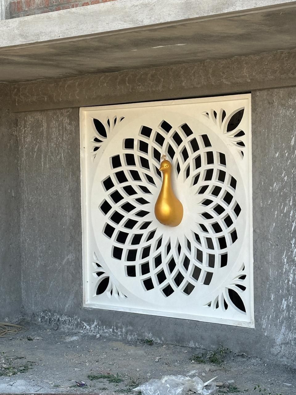 The peacock jali window set into the wall — ISKCON Coimbatore, Coimbatore, Tamil Nadu