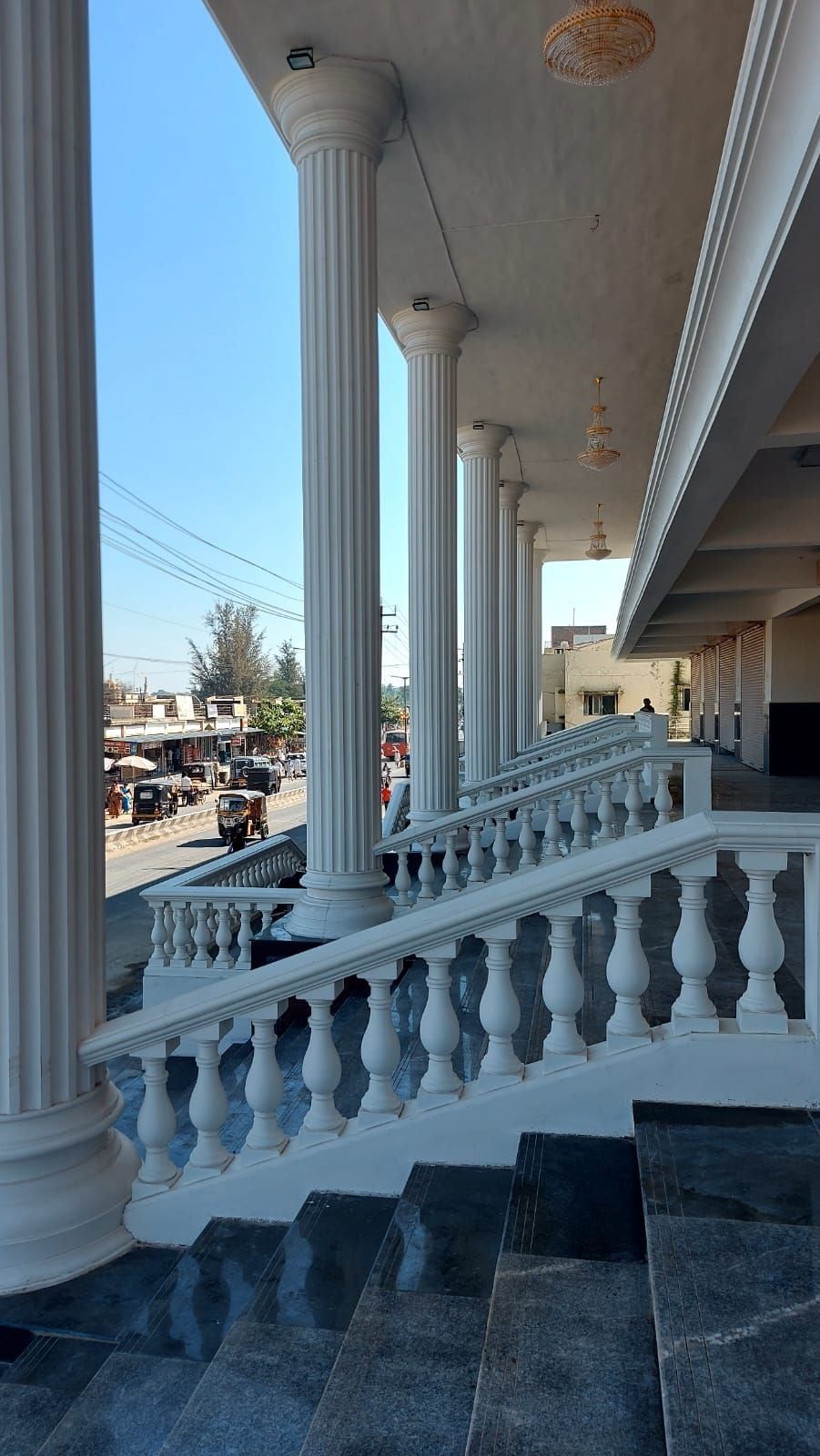 The columns and the balustrade beside the entrance steps — Janatha Bazar, Basavana Bagewadi, Karnataka
