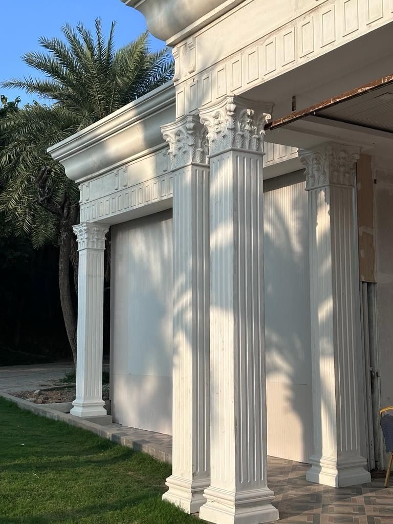 The entrance, framed by grouped fluted columns under a decorated entablature — Princess Golf