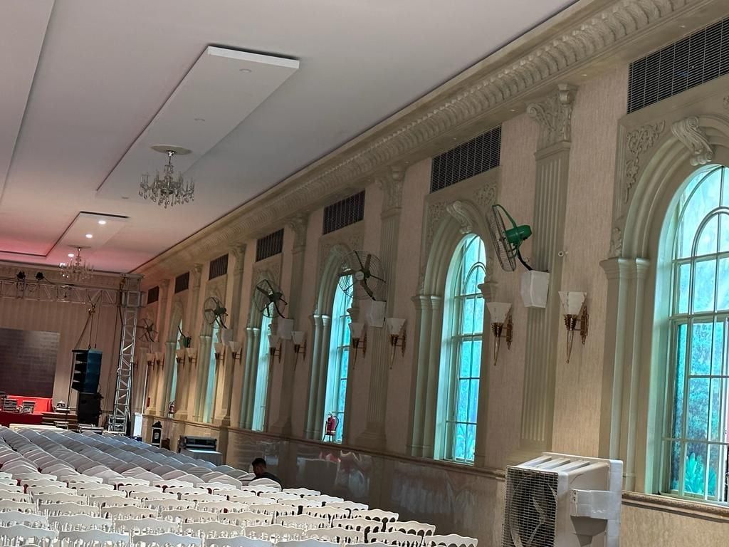 Inside the hall: arched windows between pilasters, under a deep cornice — Princess Golf