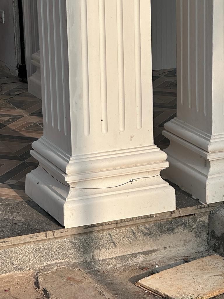 The base of the fluted columns at the entrance — Princess Golf