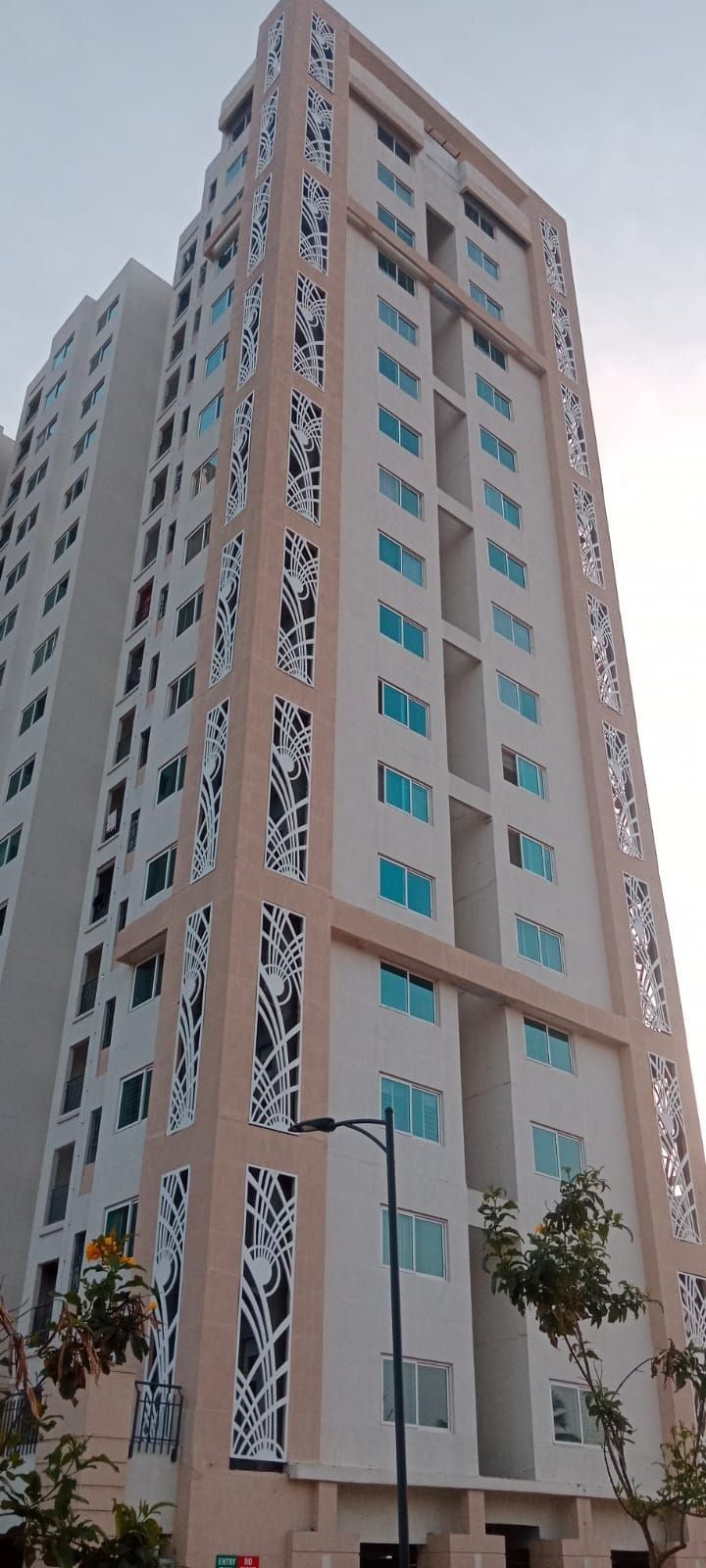 A tower face with the decorative panels beside the windows — Shriram Greenfield, Bidarahalli, Bangalore, Karnataka