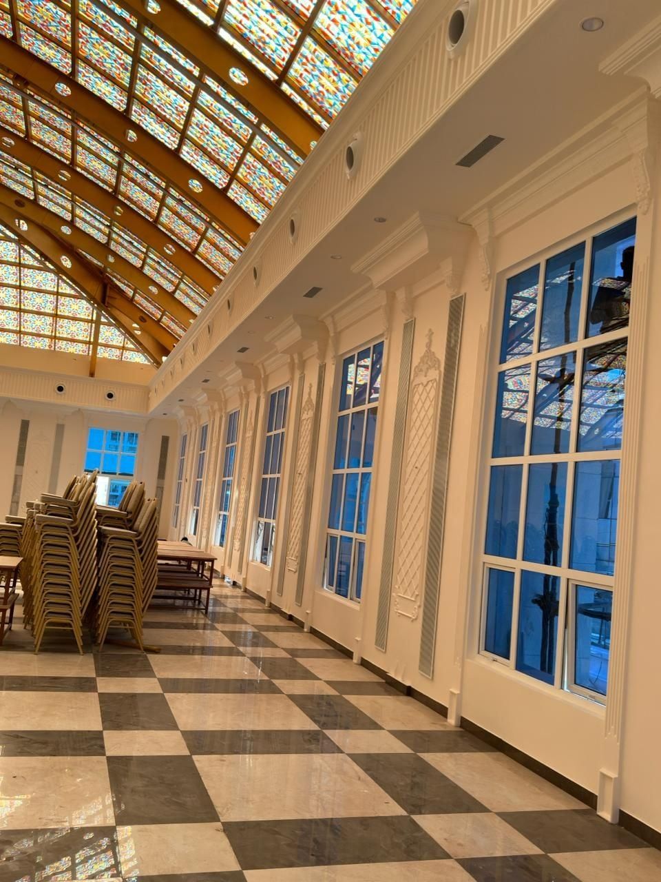 Arched windows and pilasters along the side of the hall — Venkatamma Ramaiah Kalyana Soudha